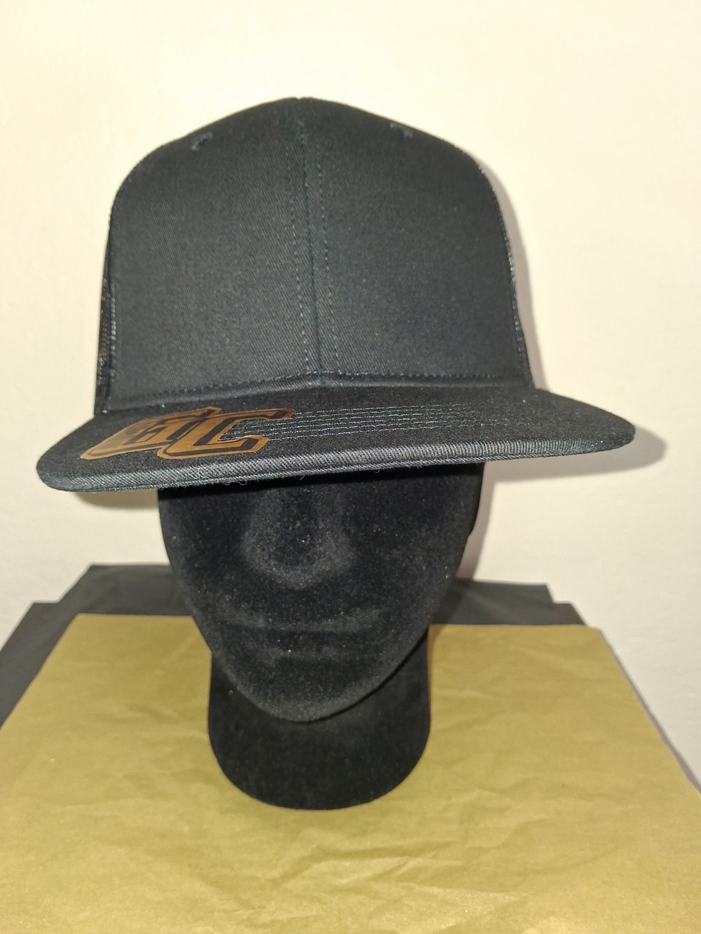 Black Flat Brim Snapback Cap with Subtle Gold Logo